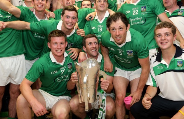 The Limerick team celebrate in the dressing room after the game