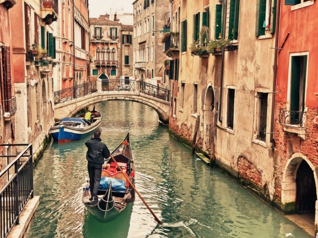 take-a-gondola-ride-through-the-winding-canals-of-venice-italy