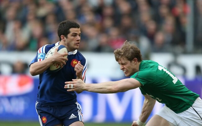 Brice Dulin is tackled by Andrew Trimble