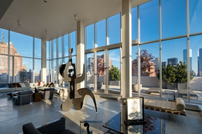 the-living-room-has-18-foot-ceilings-and-a-wood-burning-fireplace