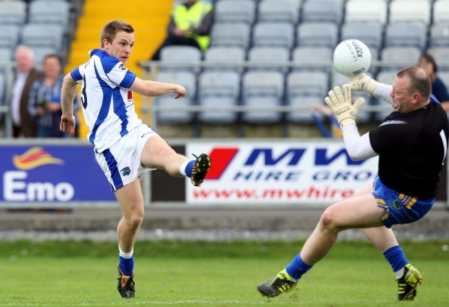 Ross Munnelly has his shot saved by Paul Fitzgerald