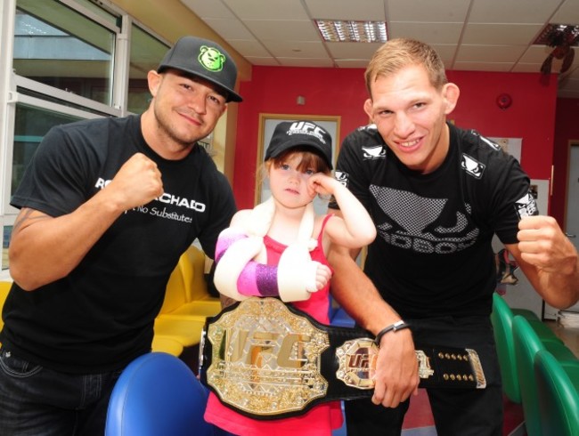 She?s the champ! UFC stars pay a surprise visit to patients at the National Children?s Hospital, Tallaght. Cub Swanson and Luke Barnatt are pictured with Emily Doyle Weston (4 years old) from Arklow, Co. Wicklow.