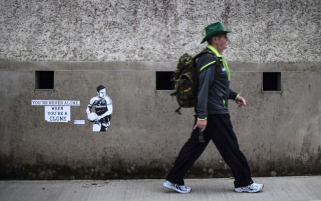 A fan makes his way into the ground