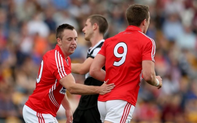 Paul Kerrigan celebrates with Aidan Walsh