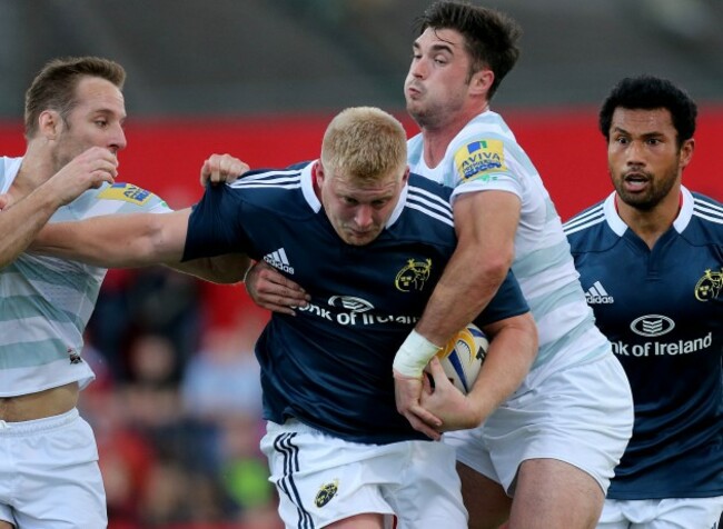 Tomas O'Leary and Eamonn Sheridan tackle John Ryan