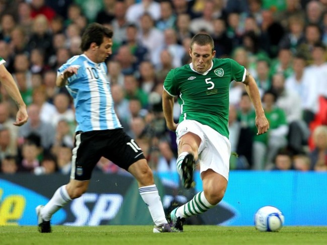 Richard Dunne and Lionel Messi