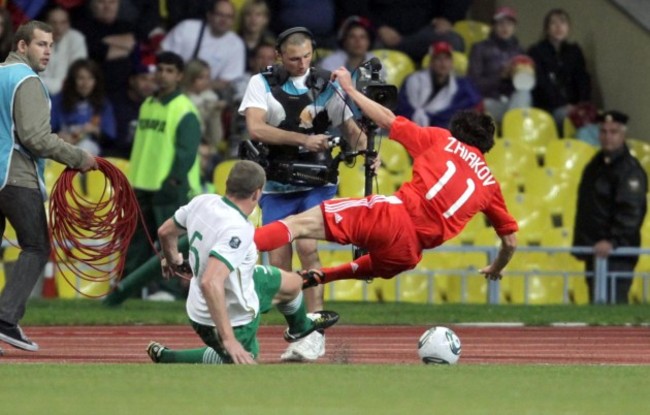 Richard Dunne tackles Yuri Zhirkov