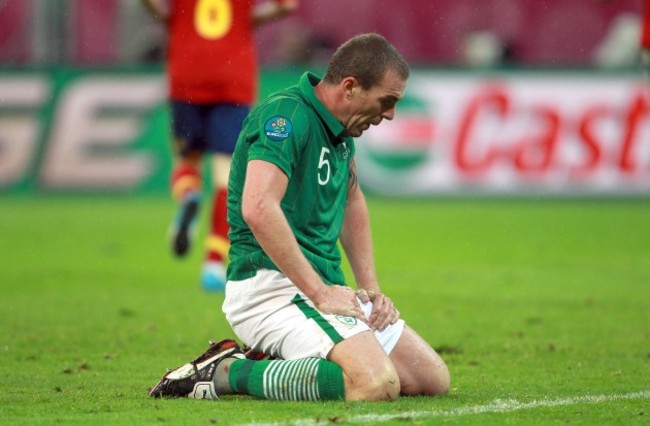 Richard Dunne dejected after Spain score their third goal