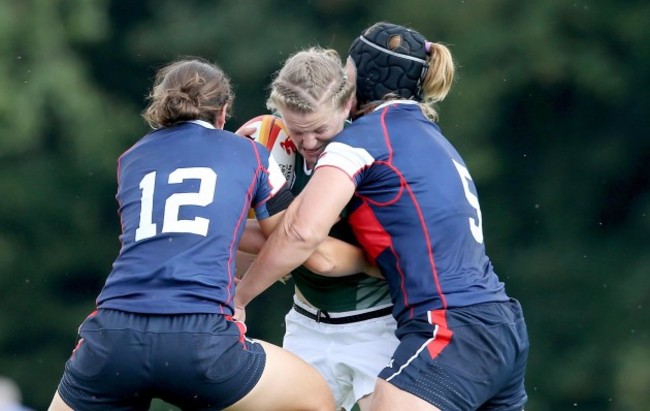 Claire Molloy tackled by Emilie Bydwell and Sarah Walsh