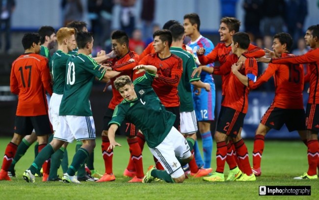 Northern Ireland and Mexico players clash during the game