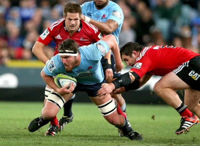 Kane Douglas tackled by Corey Flynn and Richie McCaw