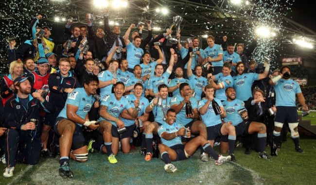 The Waratahs team celebrate winning