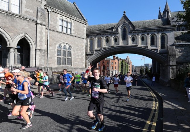 Competitors pass by Christchurch Cathedral