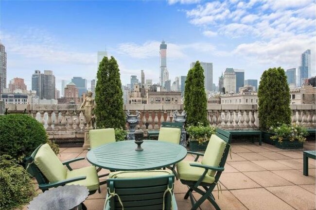 the-terrace-has-a-wet-bar-dining-area-and-lots-of-greenery