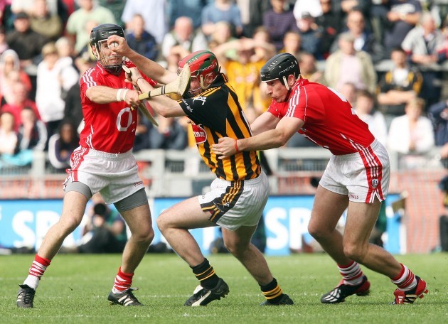 Eoin Larkin is tackled by Ben O'Connor and John Gardiner