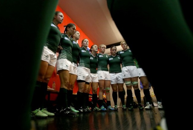 Lynne Cantwell talks to her players before the game