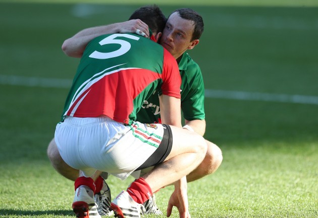 Lee Keegan is consoled by Keith Higgins after the game