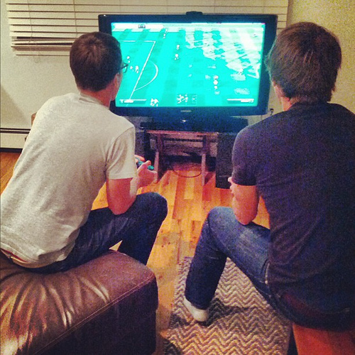 Me & @jcrowley playing FIFA. I'm sure there's a photo *exactly* like this from 1992 too (except we be on Sega Genesis)
