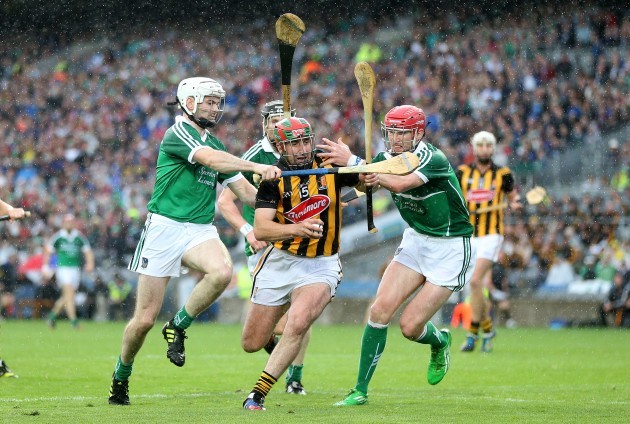 Eoin Larkin under pressure from Tom Condon and Seamus Hickey