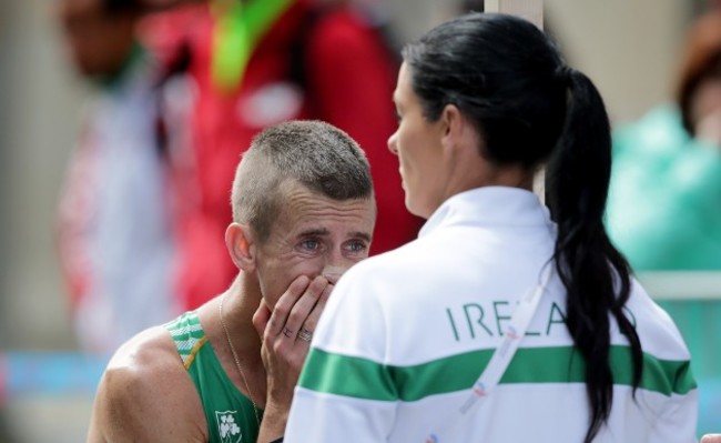 Rob Heffernan with Marian Heffernan after withdrawing from the race