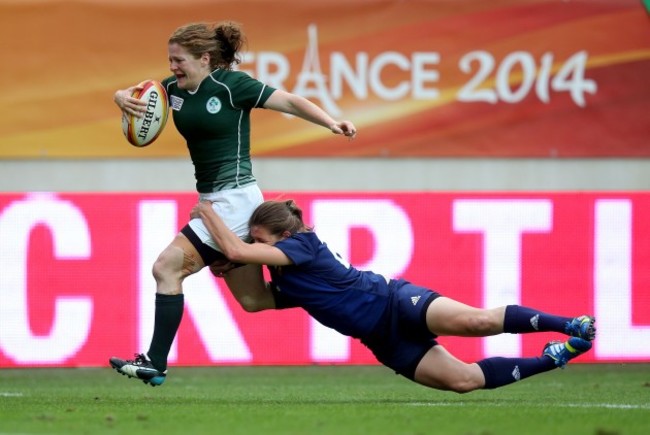 Grace Davitt beats Christelle Le Duff to score a try