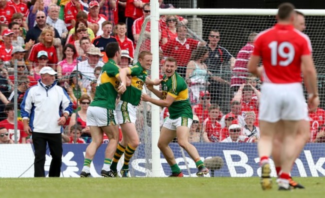 Colm Cooper celebrates his goal with Declan O'Sullivan and James O'Donoghue