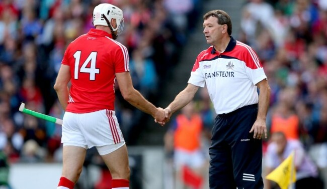 Patrick Cronin shakes hands with manager Jimmy Barry Murphy as he is replaced
