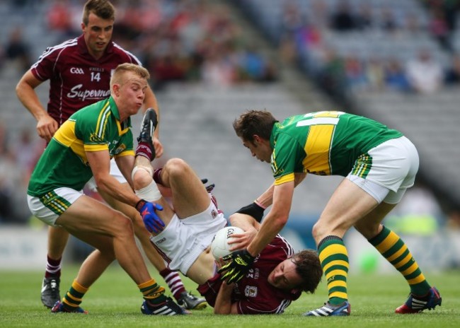 Fionn Fitzgerald and David Moran tackle John O&Otilde;Brien