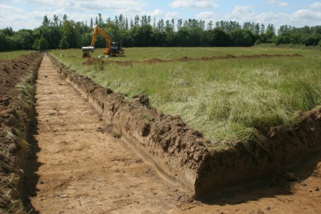 A Rubicon archaeologist engaged in testing