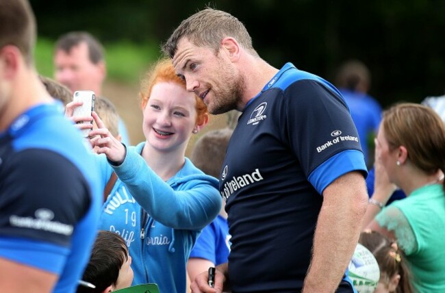 Jamie Heaslip with a Leinster supporter after training