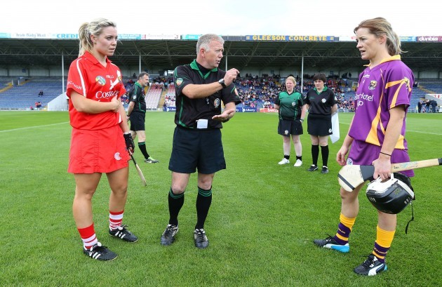 Anna Geary and Kate Kelly with referee Alan Lagrue