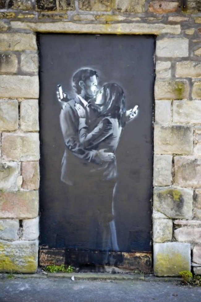 The Banksy artwork Mobile Lovers