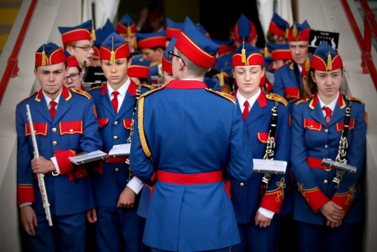 Members of the Artane Band wait to take the field