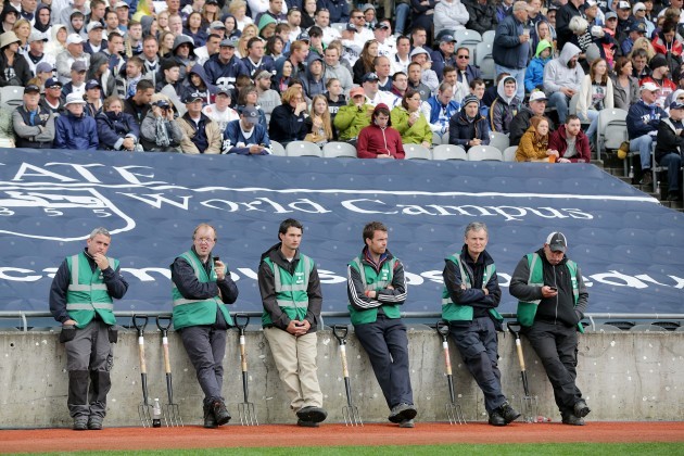 Croke Park grounds people wait for their opportunity to work on the pitch at half-time