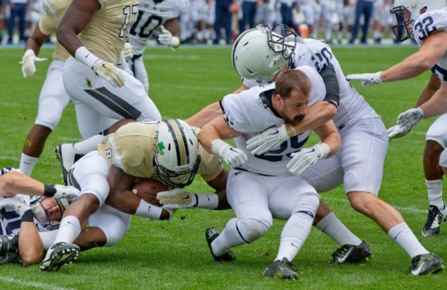 Vonn Walker has his helmet knocked off in a tackle