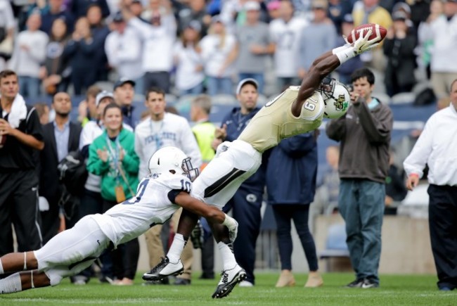 Josh Reece makes a catch as he is tackled by Trevor Williams