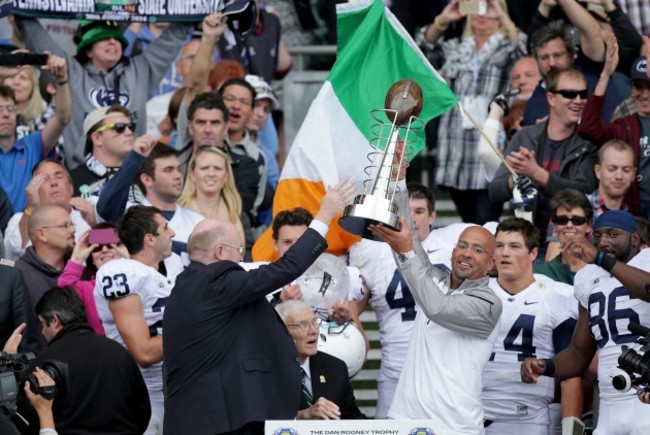 James Franklin lifts the Dan Rooney trophy