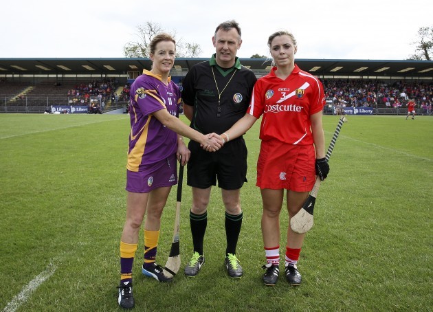 Kate Kelly and Anna Geary with referee John Dolan at the coin toss