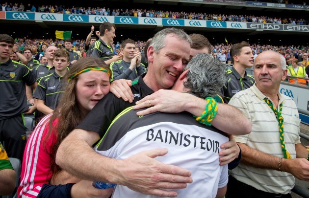 Jim McGuinness is congratulated by his brother Frank McGuinness and niece Orla McGuinness