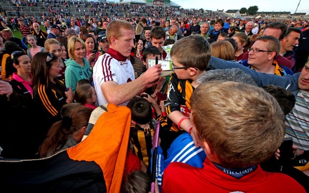 Henry Shefflin signs autographs for fans after the game