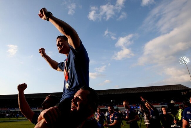 Ian Madigan and Cian Healy carry Brian O'Driscoll after the game