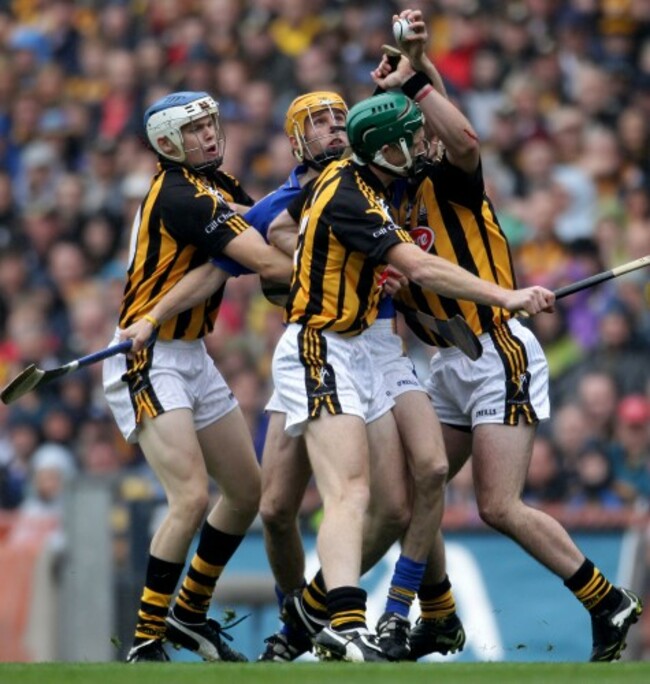 TJ Reid, Henry Shefflin and Eoin Larkin tackle Shane McGrath