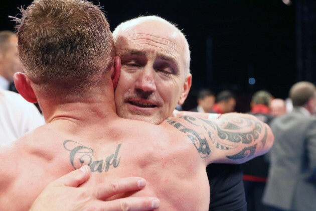 Carl Frampton celebrates winning with Barry McGuigan