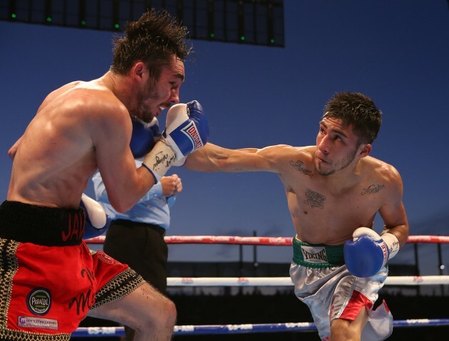 Jose Estrella lands a punch on Jamie Conlan