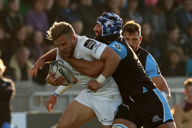 LeinsterÕs Ian Madigan is tackled by Glasgow Warriors Josh Strauss