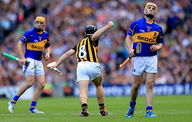 Shane MCGrath and Cathal Barrett dejected as Richie Hogan celebrates scoring a point