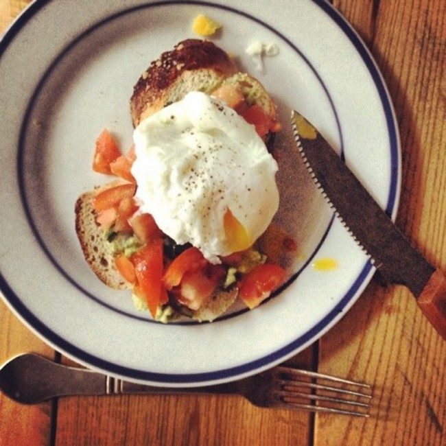 Reliving brunch made by @nialler9 this morning. Perfect poached egg on guacamole, tomato and toasted brioche.