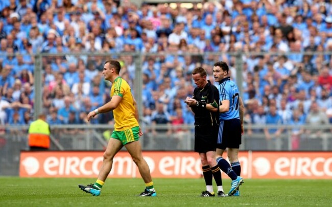 Neil McGee is black carded by referee Joe McQuillan