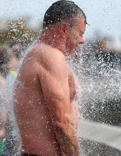 General view of competitors showering after the race