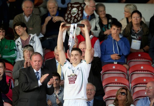 Gerry Keegan lifts the trophy